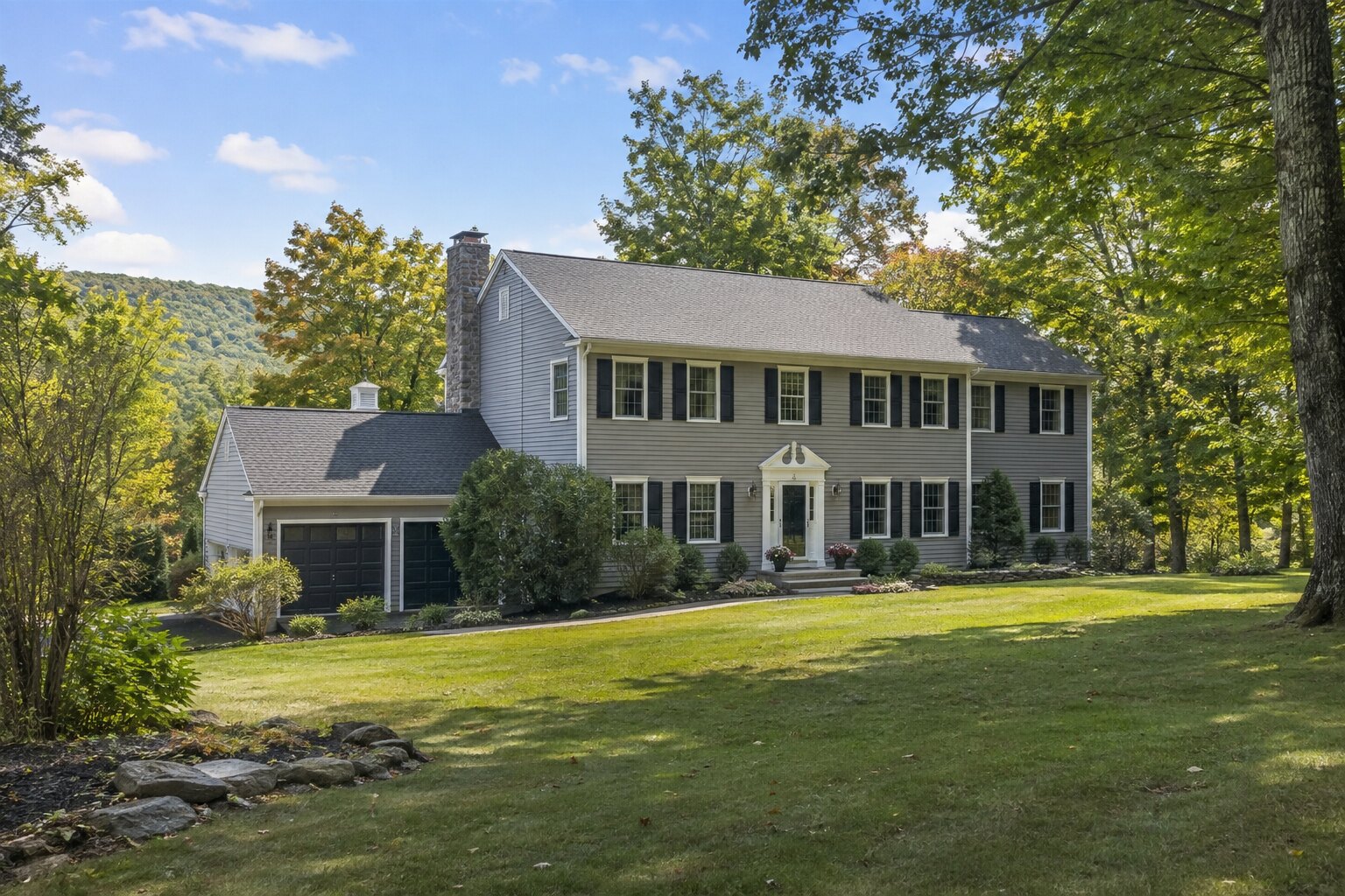 Colonial home on a wooded Sussex County-style property